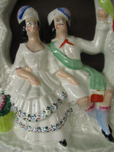 Load image into Gallery viewer, Antique Staffordshire Flatback Figurine. Courting Couple Sitting Under a Bough
