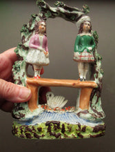 Load image into Gallery viewer, Miniature Staffordshire Flatback Figurine. Couple in a Bough with Swan and Bridge
