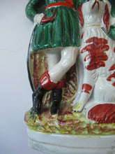 Load image into Gallery viewer, Antique Victorian Spill Vase Featuring a Pair of Huntsmen Wearing Short Green Tunics with a Large Dog
