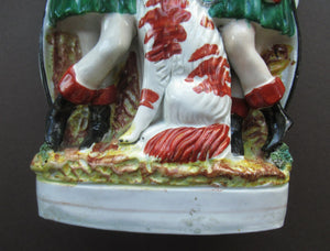 Antique Victorian Spill Vase Featuring a Pair of Huntsmen Wearing Short Green Tunics with a Large Dog