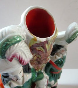 Antique Victorian Spill Vase Featuring a Pair of Huntsmen Wearing Short Green Tunics with a Large Dog