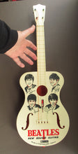 Load image into Gallery viewer, Genuine Vintage 1960s Beatles Selcol Toy Guitar with Images of the Band
