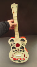 Load image into Gallery viewer, Genuine Vintage 1960s Beatles Selcol Toy Guitar with Images of the Band
