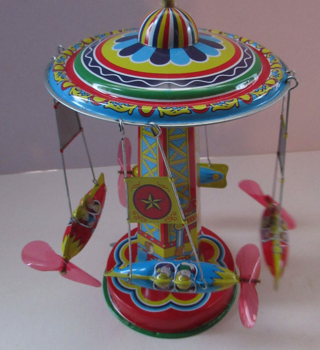 Products Vintage 2000 SCHYLLING Rocket Ride Carousel. Tin Plate Clockwork. Rotating Rockets. BOXED