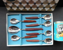 Load image into Gallery viewer, Vintage 1960s GLOSSWOOD Cutlery. Stainless Steel Six Dessert Spoons &amp; Larger Serving Spoon with Teak Effect Handles. Original Retail Box
