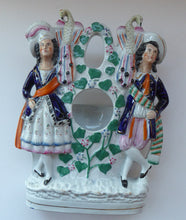 Load image into Gallery viewer, Antique STAFFORDSHIRE POTTERY Pocket Watch Holder. Large Figurine with Couple Standing in Vineyard with Two Peacocks Above
