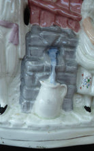 Load image into Gallery viewer, Antique STAFFORDSHIRE Flatback Figurine. Victorian Couple Standing Beside a Water Wall. Excellent Condition
