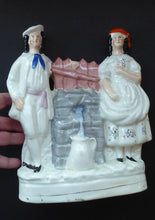 Load image into Gallery viewer, Antique STAFFORDSHIRE Flatback Figurine. Victorian Couple Standing Beside a Water Wall. Excellent Condition
