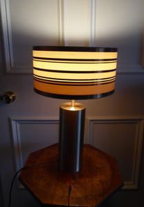 1960s Vintage Table Lamp with Tubular Gold Tone Metal Cylindrical Body and Original Metallic Stripes Drum Shade