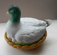 Load image into Gallery viewer, Rare ANTIQUE Staffordshire Bisque DUCK on a NEST. Victorian era; and in excellent condition
