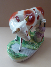 Load image into Gallery viewer, Genuine ANTIQUE STAFFORDSHIRE Figurine. Woman / Milkmaid with Large Cow by a Stream; 1880s
