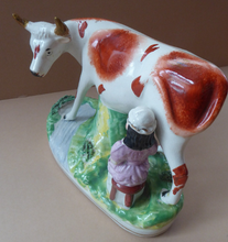 Load image into Gallery viewer, Genuine ANTIQUE STAFFORDSHIRE Figurine. Woman / Milkmaid with Large Cow by a Stream; 1880s
