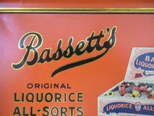 Load image into Gallery viewer, Vintage 1930s Art Deco Bassett&#39;s Liquorice All-sorts in Orange Tin
