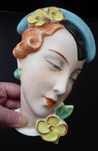 Load image into Gallery viewer, ART DECO Royal Dux, Czechoslovakia Wall Mask. 1930s Lady with Stylish Flapper Hat and Yellow Flower on her Lapel
