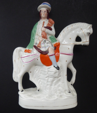 Load image into Gallery viewer, Antique Victorian STAFFORDSHIRE Figurine. Scottish Gentleman on Horseback. Dressed in His Kilt and Playing the Bagpipes. 11 inches

