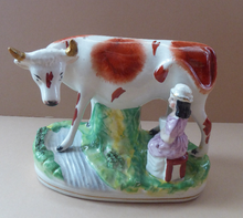 Load image into Gallery viewer, Genuine ANTIQUE STAFFORDSHIRE Figurine. Woman / Milkmaid with Large Cow by a Stream; 1880s
