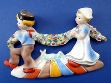 Load image into Gallery viewer, 1950s Nursery Wall Plaque Dutch Boy and Girl Carrying Garland of Tulips
