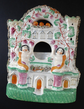Load image into Gallery viewer, Antique STAFFORDSHIRE POTTERY Pocket Watch Holder. Unusual 1870s Figurine in the Form of Couple in an Orangerie

