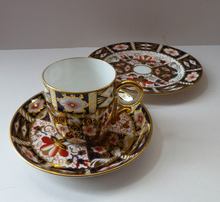 Load image into Gallery viewer, ROYAL CROWN DERBY Imari Pattern 2451.  One Trio Consisting of a Cup &amp; Saucer and a Side Plate
