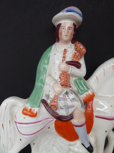 Antique Victorian STAFFORDSHIRE Figurine. Scottish Gentleman on Horseback. Dressed in His Kilt and Playing the Bagpipes. 11 inches