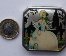 Load image into Gallery viewer, Vintage Art Deco Gwenda Celluloid Foil Miniature Powder Compact. Lid Decorated with an Image of a Pretty Lady in a Garden Setting
