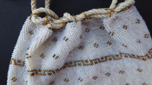 Load image into Gallery viewer, Sweet Little Vintage Reticule Drawstring Glass Beaded Bag. Cream &amp; Gold Mirco Beads. Comes with Free Embroidered Trim. Good Condition
