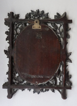 Load image into Gallery viewer, Antique 1880s BLACK FOREST MIRROR Frame in the form of an easel stand; decorated with intricate carvings of oak leaves &amp; acorns
