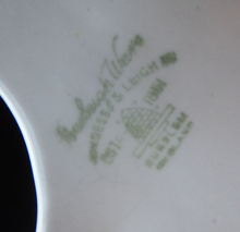 Load image into Gallery viewer, SINGLE Burleigh Ware 1950s Wall Pocket. Abstract Shape with White Exterior and Black Interior. With Stars Pattern
