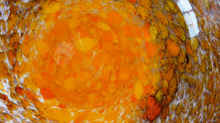 Load image into Gallery viewer, Wee SCOTTISH MONART GLASS Shallow Pin Dish. Mottled Orange, Red, Yellow and Brown Glass with Gold Aventurine &amp; Customary Raised Pontil Mark
