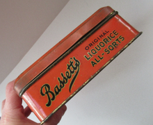 Load image into Gallery viewer, Vintage 1930s Art Deco Bassett&#39;s Liquorice All-sorts in Orange Tin
