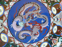 Load image into Gallery viewer, Antique Cloisonne Charger. Late 19th Century Large Size, over 14 inches: Decorated with a Swirling Dragon and Intricate Decorative Border
