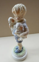 Load image into Gallery viewer, Royal Worcester Figurine MONDAY&#39;S CHILD.  Modelled by Freda Doughty. No 3519. Boy Holding Puppies. PRISTINE
