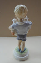 Load image into Gallery viewer, Royal Worcester Figurine MONDAY&#39;S CHILD.  Modelled by Freda Doughty. No 3519. Boy Holding Puppies. PRISTINE
