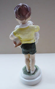 Royal Worcester Figurine. ALL MINE.  Modelled by Freda Doughty. No 3519. Boy Holding Puppies. PRISTINE