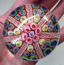 Load image into Gallery viewer, Collectable 1970s Scottish Glass Paperweight with 7 Spokes. Unusual Red Ground and Tutti Frutti Colours
