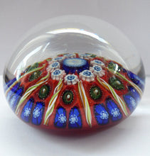 Load image into Gallery viewer, Beautiful VASART Scottish Glass Paperweight with 9 Spokes; with scarlet ground, latticino canes &amp; millefiore. 3 inches diameter
