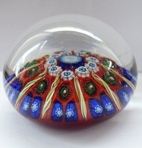 Beautiful VASART Scottish Glass Paperweight with 9 Spokes; with scarlet ground, latticino canes & millefiore. 3 inches diameter