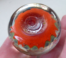 Load image into Gallery viewer, Collectable 1970s Scottish Glass Paperweight with 7 Spokes. Unusual Red Ground and Tutti Frutti Colours
