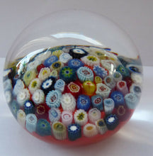Load image into Gallery viewer, Vintage Scottish Paperweight, possibly by STRATHEARN GLASS. Scarlet Ground with a Carpet of Millefiori Canes
