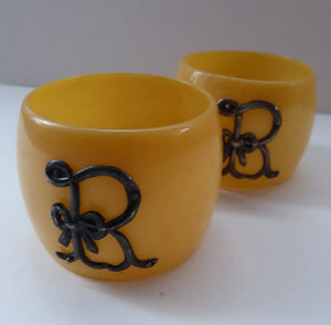 NAPKIN RINGS. Monogrammed R. Antique Celluloid Napkin Rings; both with Solid SILVER Monograms