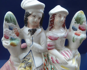 ANTIQUE Victorian Staffordshire Figurine. Poor Man's Clock. Two Highland Figures with Fruiting Vine