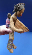 Load image into Gallery viewer, CLOTH DOLL. Vintage 1950s Native Lady Doll. Hand Made Lady Carrying a Wicker Basket and with Baby on her Backcoth
