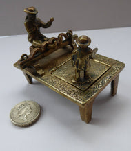 Load image into Gallery viewer, ANTIQUE INKWELL. An Extremely Rare Miniature Example Featuring a Little Man in Village Stocks Being Pelted with Fruit
