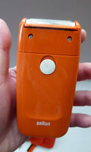 Load image into Gallery viewer, Orange Braun Electric Shaver, 1970s. Complete with original brush &amp; in its own orange velvet lined carrying case
