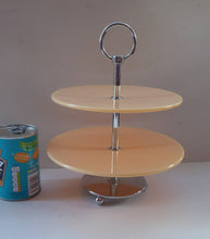 Load image into Gallery viewer, 1950s Perspex CAKE STAND Peach Coloured. Art Deco Style with Lucite Plates &amp; Fine Quality Chrome Base, Stand and Carrying Handle. Two Tiers
