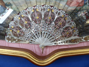 Antique FRAMED Hand Painted Fan with mother of pearl sticks and guards:  shaped, carved, pierced and gilt. FETE GALANTE design
