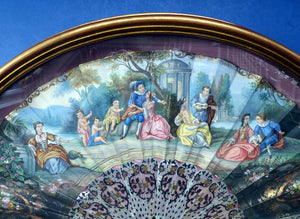 Antique FRAMED Hand Painted Fan with mother of pearl sticks and guards:  shaped, carved, pierced and gilt. FETE GALANTE design