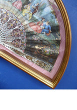 Load image into Gallery viewer, Antique FRAMED Hand Painted Fan with mother of pearl sticks and guards:  shaped, carved, pierced and gilt. FETE GALANTE design
