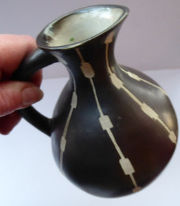 Unusual Black and White Pitcher or Jug. Matt Black Glaze with Incised Abstract Pattern. Signed SILA on the base