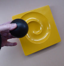 Load image into Gallery viewer, ARTEMIDE MILANO. 1969 Classic Italian Design by Eleonore Peduzzi Riva;  Spiral / Spyros Ashtray. Yellow Plastic with Black Ball
